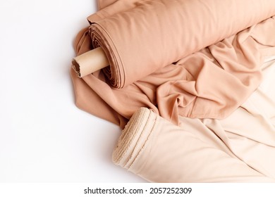 Rolls of pastel color fabric isolated on white - Shutterstock ID 2057252309