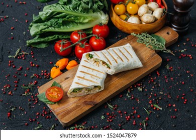 Rolls With Pepperoni, Salad On A Black Background