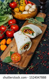 Rolls With Pepperoni, Salad On A Black Background