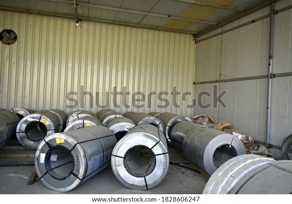 Rolls of steel sheet stored in\
warehouse; galvanized steel coil in the Duct Factory. Packed rolls\
of steel sheet, Cold rolled steel coils. Muscat, Oman :\
07-10-2020