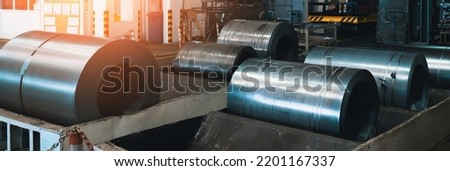 Rolls of steel sheets. Metal coils in metalwork factory workshop