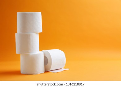 Rolls Of Toilet Paper On Color Background