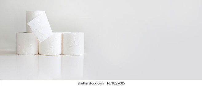 Rolls Of Toilet Paper On Light Gray Background. Horizontal Banner For Website, Social Networks, Online Store Of Household Goods