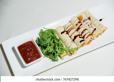 Rolls with vegetables on a light background