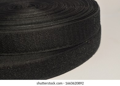 Rolls of Velcro tape strips isolated on white background.