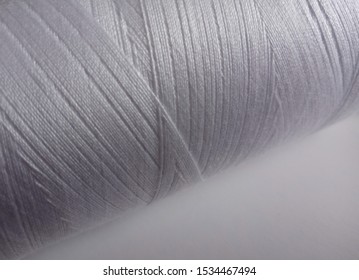 Rolls Of White Cotton Yarn On A White Background