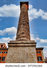 Roma, Italy - 05.20.2014: The Column Of Marcus Aurelius In Front Of Palazzo Chigi In Rome Erected To Celebrate The Victories Of The Emperor On The Danube. Created From The Model Of 