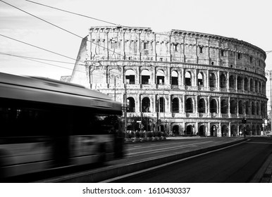 Roma, Italy, 27/11/2019: Rome Colosseum With Buses Moving In City Traffic, Travel Reportage