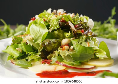 Romaine Lettuce Salad With Apple, Peanut, Walnut And Cranberry Vinaigrette.