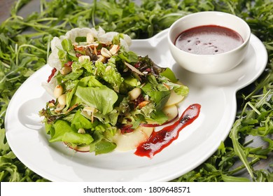 Romaine Lettuce Salad With Apple, Peanut, Walnut And Cranberry Vinaigrette.