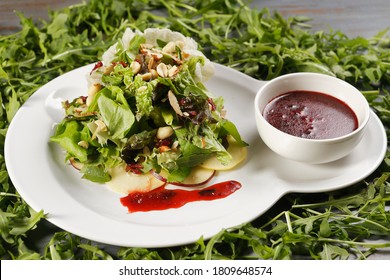 Romaine Lettuce Salad With Apple, Peanut, Walnut And Cranberry Vinaigrette.