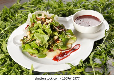 Romaine Lettuce Salad With Apple, Peanut, Walnut And Cranberry Vinaigrette.