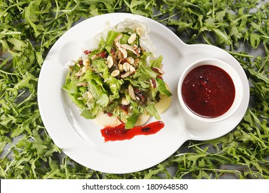 Romaine Lettuce Salad With Apple, Peanut, Walnut And Cranberry Vinaigrette.