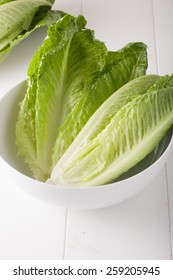 Romaine Lettuce In A White Bowl On White Background