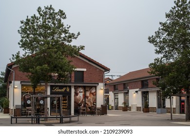 Romainville, France - January 13 2022: Chocolat Bar LINDT Shop In Paddock Paris EST Factory Outlet Village Near Paris On A Cloudy Winter Morning.