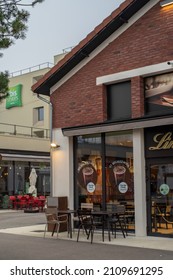 Romainville, France - January 13 2022: Chocolat Bar LINDT Shop In Paddock Paris EST Factory Outlet Village Near Paris On A Cloudy Winter Morning.