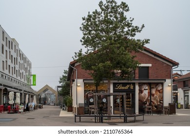 Romainville, France - January 13 2022: Chocolat Bar LINDT Shop In Paddock Paris EST Factory Outlet Village Near Paris On A Cloudy Winter Morning. Selective Focus.