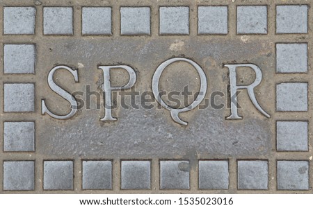 Roman Acronym SPQR namely Senatus Populusque Romanus that means Senate and People of Rome in Latin language