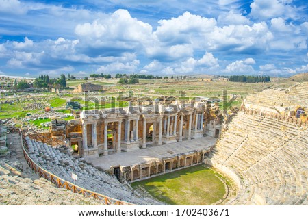Roman amphitheater in the ruins of Hierapolis, in Pamukkale, Turkey. UNESCO world heritage in Turkey. Ruined ancient city in Europe. Popular tourist destination in Turkey