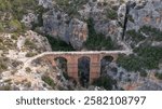 The Roman Aqueduct of Pena Cortada located near Valencia, Spain is a colossal work of hydraulic engineering built in the 1st century AD.