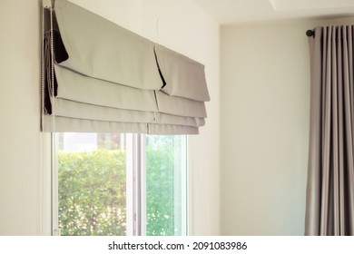 Roman blind curtain decoration in living room interior - Shutterstock ID 2091083986