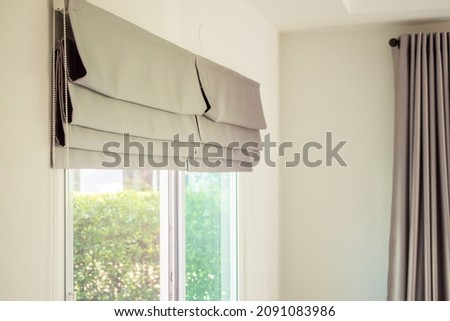 Roman blind curtain decoration in living room interior