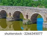 Roman bridge over river Guadiana leading to Alcazaba fortress in Merida, Spain