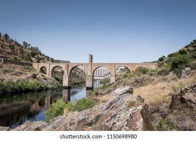 Roman bridge over the Tagus River in the city of Alcantara (Caceres, Spain) - Shutterstock ID 1150698980