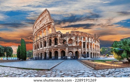 Roman Coliseum at sunset, summer view under the clouds, Italy