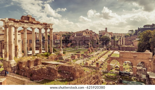 Roman Empire ruins, Rome, Italy. Scenery of Roman\
Forum or Foro Romano, panorama of Ancient ruins in Roma city\
center. Vintage style photo, remains of past civilization view,\
Temple of Saturn in left
