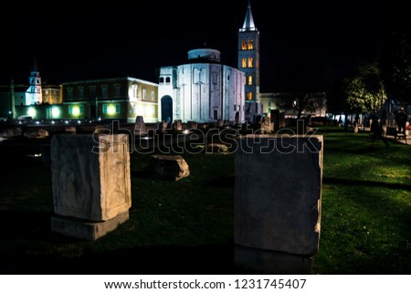 Roman Forum, Church Sv. Donat and red lightned bell tower of Zadar at night, Croatia, Europe