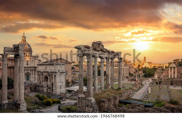 Roman Forum\
at sunset in Rome, Italy. Roma top landmark and tourists\
attraction. Ruins of the ancient forum at Palatino hill, Scenic\
urban landscape in the evening, cloudy\
sky.