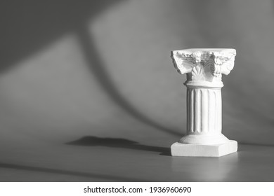 Roman Marble Column Backdrop With Art Deco Decor, Display, Mockup. Gray Background For Product Presentation With Shadows And Light From Windows. Window Natural Shadow Overlay Effect On Grey Surface.