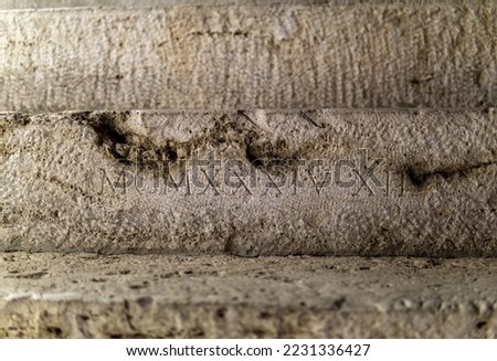 Roman numerals engraved on stone steps in Mercati di Traiano