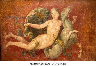Roman Pompeian fresco representing mythological figures in Naples, Italy