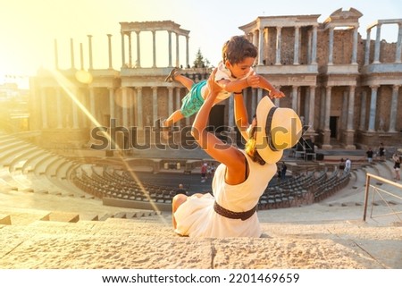 Roman Ruins of Merida, a mother with her baby having fun in the Roman Theater. Extremadura, Spain