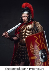 Roman Soldier Weared In Bronze Armor Holding Sword