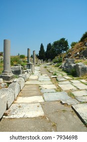 Roman Street In Pompeii With Chariot Grooves In The Stone And Stepping Stones For Pedestrians