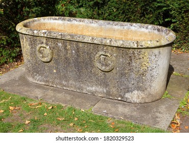 Roman Style Stone Bath On Concrete Plinth              