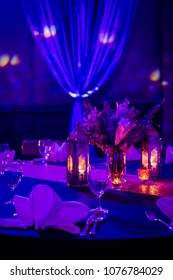 romance  dinner setup idea violet and warm tone decoration on the table for indian wedding 