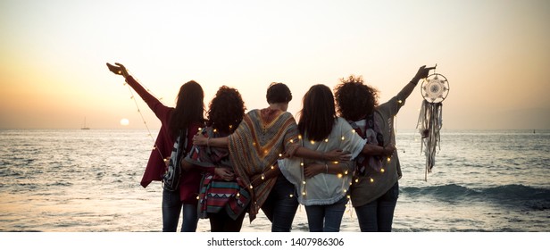 Romance And Emotion Concept With Group Of People Women Friends Viewed From Back Hugging And Ejoying The Sunset In Outdoor Nature Sea Vacation Concept - Friendship And Freedom For Travelers