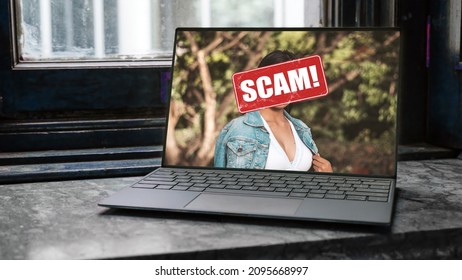 A romance scam concept. A fake social media photo or dating profile using a stolen image of a woman displayed on a laptop screen.