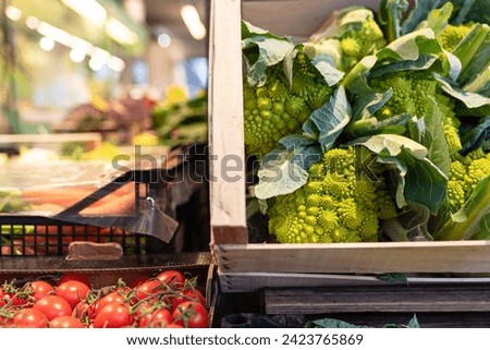 Romanesco broccoli displayed on a market vegetable stall