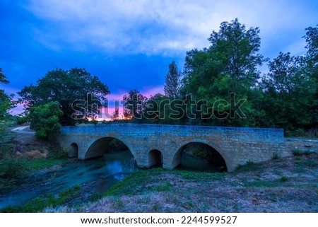 Romanesque bridge of Artigue and river Osse near Larressingle on route to Santiago de Compostela, UNESCO World Heritage Site, departement Gers, France