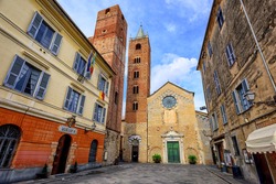 Romanesque Church With High Bell Towers In The Center Of Medieval Town Albenga, Italy