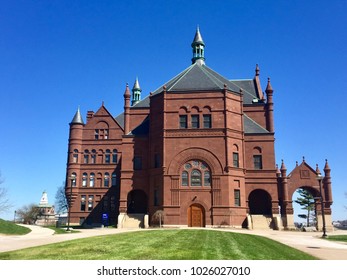 Romanesque Crouse College Building In Syracuse University Campus Against A Blue Sky In Syracuse, New York.