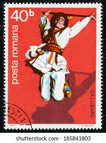 ROMANIA - CIRCA 1977: A stamp printed in Romania from the "Calusarii Folk Dance" issue shows leaping dancer with stick, circa 1977.