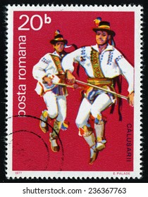 ROMANIA - CIRCA 1977: A stamp printed in Romania from the "Calusarii Folk Dance" issue shows two dancer with stick, circa 1977.