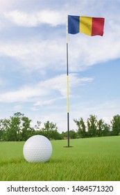Romania Flag On Golf Course Putting Green With A Ball Near The Hole