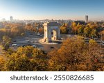 Romania landmark. Arch of Triumph aerial photo. Beautiful aerial view of this amazing landmark from Bucharest, Romania, during an autumn morning sunrise. Travel to Romania.